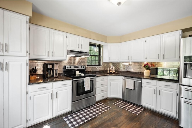 617 Woodcrest Dr, Robinson Twp Nwa, PA 15205 - kitchen featuring stainless steel appliances, under cabinet range hood, white cabinets, dark wood-style floors, and decorative backsplash