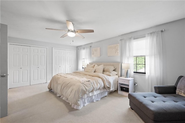 617 Woodcrest Dr, Robinson Twp Nwa, PA 15205 - bedroom with multiple closets, light carpet, and a ceiling fan
