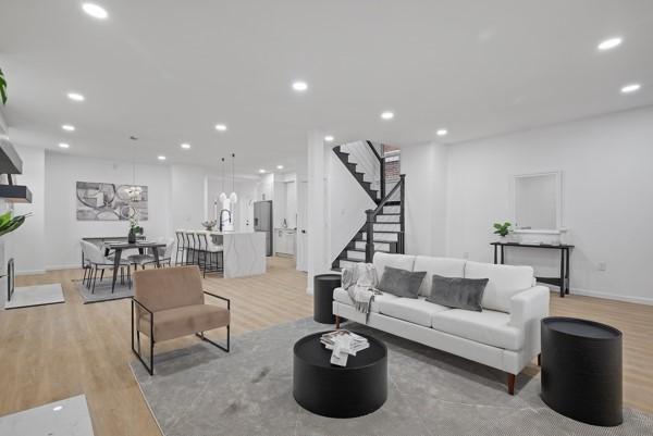2356 Pittock St, Squirrel Hill, PA 15217 - living room with stairway, light wood finished floors, and recessed lighting