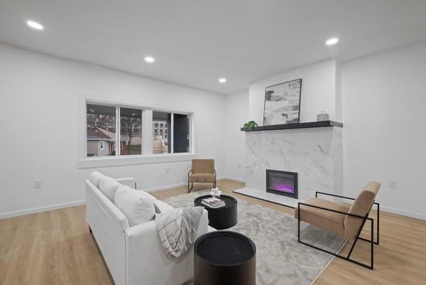 2356 Pittock St, Squirrel Hill, PA 15217 - living room with wood finished floors, recessed lighting, and a high end fireplace