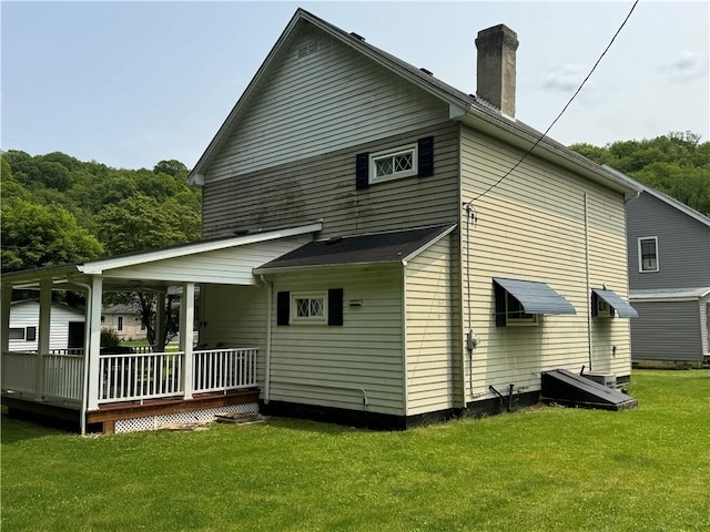 515 Pike Run Dr W, Pike Run Twp, PA 15427 - back of property with a yard and a chimney