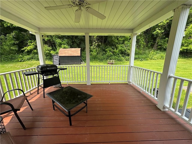 515 Pike Run Dr W, Pike Run Twp, PA 15427 - deck with ceiling fan, a storage unit, a lawn, and area for grilling