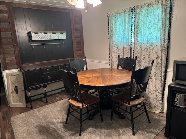 515 Pike Run Dr W, Pike Run Twp, PA 15427 - dining space with wood finished floors, a wainscoted wall, and a ceiling fan