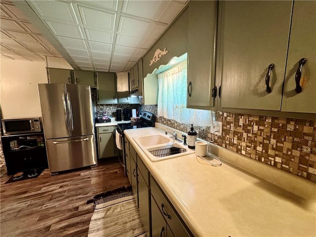 515 Pike Run Dr W, Pike Run Twp, PA 15427 - kitchen with stainless steel appliances, dark wood-type flooring, light countertops, tasteful backsplash, and an ornate ceiling