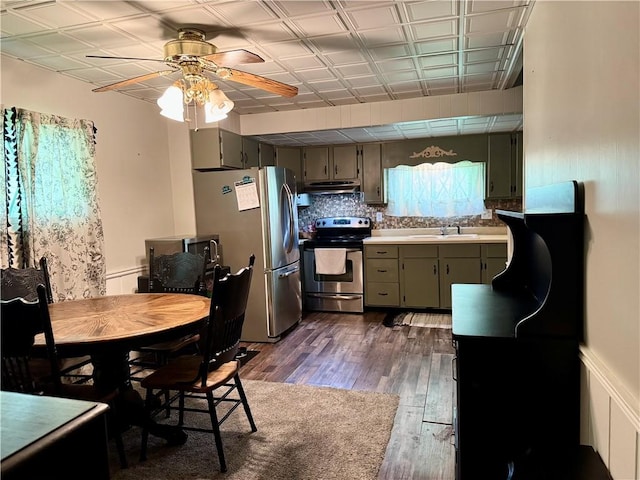 515 Pike Run Dr W, Pike Run Twp, PA 15427 - kitchen featuring stainless steel appliances, under cabinet range hood, a ceiling fan, wood finished floors, and light countertops