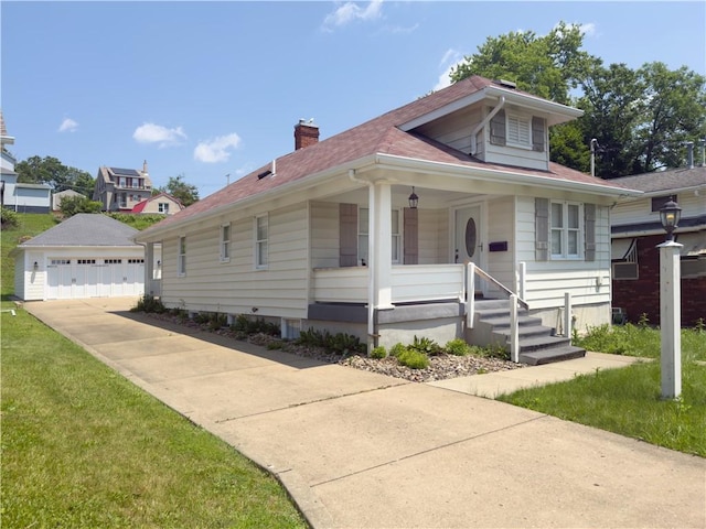 1604 Ross Hill Rd, Patterson Twp, PA 15010 - bungalow with an outdoor structure, a chimney, a garage, covered porch, and a shingled roof