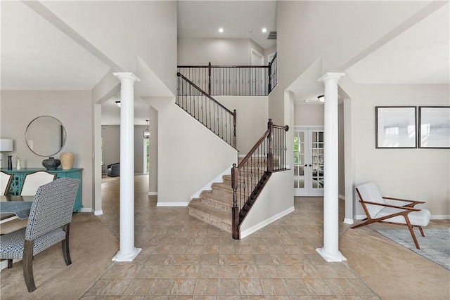207 Eddie Lewis Dr, Pine Twp Nal, PA 15090 - staircase with decorative columns, stone finish flooring, french doors, and a towering ceiling