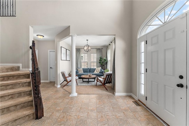 207 Eddie Lewis Dr, Pine Twp Nal, PA 15090 - entrance foyer featuring stone finish floors, stairway, and ornate columns