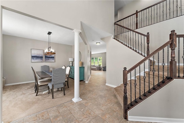 207 Eddie Lewis Dr, Pine Twp Nal, PA 15090 - dining space featuring a chandelier, stone finish floors, stairway, and decorative columns
