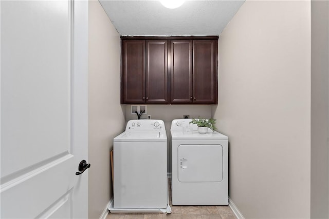 207 Eddie Lewis Dr, Pine Twp Nal, PA 15090 - laundry room with washing machine and clothes dryer, cabinet space, and a textured ceiling