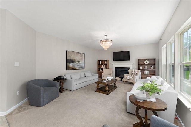 207 Eddie Lewis Dr, Pine Twp Nal, PA 15090 - living room featuring light colored carpet, a chandelier, and a glass covered fireplace
