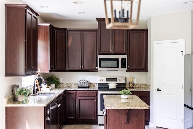 207 Eddie Lewis Dr, Pine Twp Nal, PA 15090 - kitchen featuring stainless steel appliances, dark brown cabinets, light stone counters, and recessed lighting
