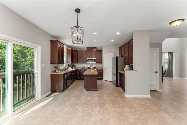 207 Eddie Lewis Dr, Pine Twp Nal, PA 15090 - kitchen with stainless steel appliances, a center island, a chandelier, recessed lighting, and light stone countertops