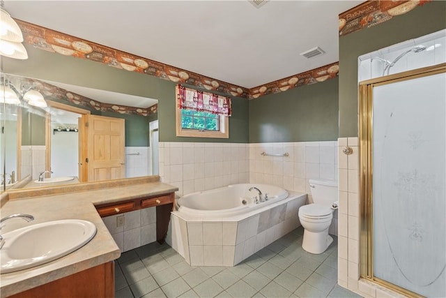 412 Hawthorn Rd, East Finley, PA 15323 - full bath with double vanity, a bath, a shower stall, tile patterned floors, and tile walls