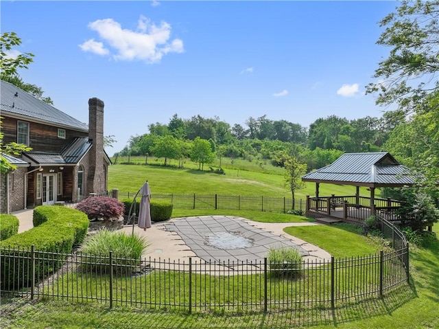 412 Hawthorn Rd, East Finley, PA 15323 - fenced backyard with a gazebo, a patio, and french doors