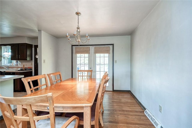 215 Columbia Dr, Center Twp Bea, PA 15001 - dining area with light wood-style floors, a chandelier, and french doors