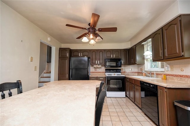 215 Columbia Dr, Center Twp Bea, PA 15001 - kitchen featuring black appliances, tasteful backsplash, light countertops, dark brown cabinets, and ceiling fan