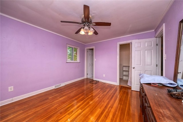 215 Columbia Dr, Center Twp Bea, PA 15001 - unfurnished bedroom with wood-type flooring, crown molding, and ceiling fan