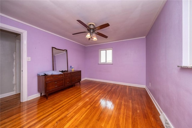 215 Columbia Dr, Center Twp Bea, PA 15001 - unfurnished bedroom with hardwood / wood-style flooring, crown molding, and a ceiling fan