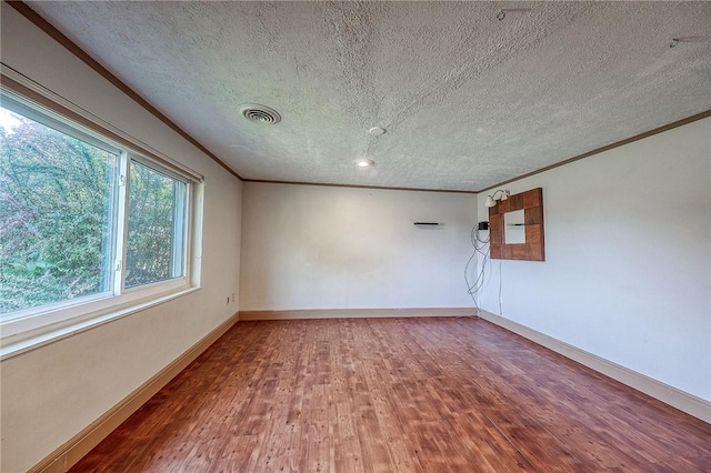 215 Columbia Dr, Center Twp Bea, PA 15001 - unfurnished room featuring crown molding, a textured ceiling, and wood finished floors