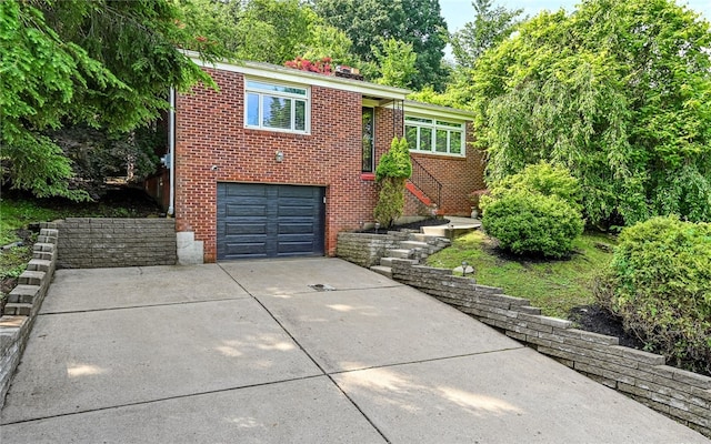 5038 Walton Rd, Jefferson Hills, PA 15332 - view of front facade featuring concrete driveway, brick siding, and a garage