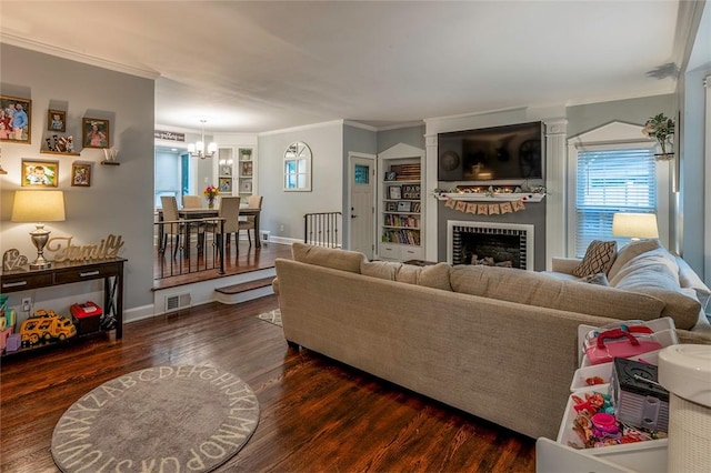 1283 Ashton Rd, Sharon, PA 16146 - living area featuring wood finished floors, a chandelier, crown molding, and a fireplace