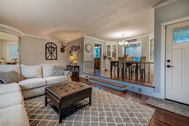 1283 Ashton Rd, Sharon, PA 16146 - living area with a chandelier, ornamental molding, wood finished floors, and arched walkways