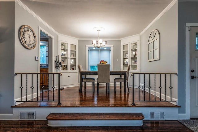 1283 Ashton Rd, Sharon, PA 16146 - dining room featuring built in features, a chandelier, crown molding, and wood finished floors