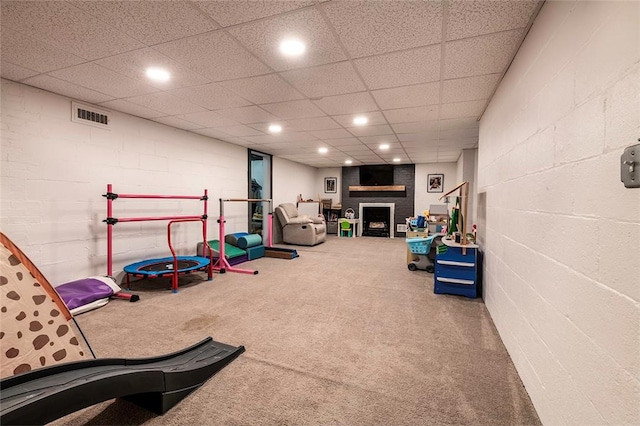 1283 Ashton Rd, Sharon, PA 16146 - game room with carpet flooring, a fireplace, recessed lighting, and concrete block wall