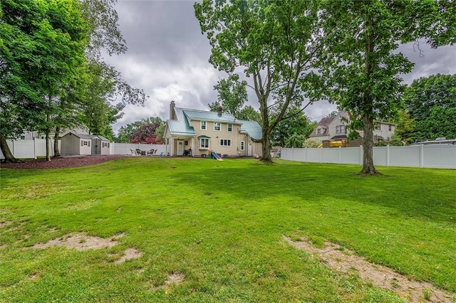 1283 Ashton Rd, Sharon, PA 16146 - fenced backyard featuring a storage unit