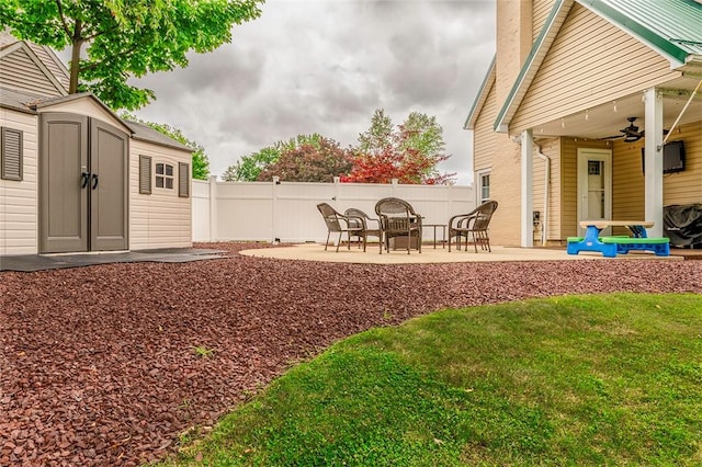 1283 Ashton Rd, Sharon, PA 16146 - view of yard featuring a patio, a ceiling fan, and a storage unit