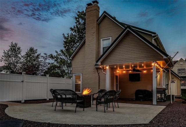 1283 Ashton Rd, Sharon, PA 16146 - rear view of property with a fire pit, a patio, and a chimney