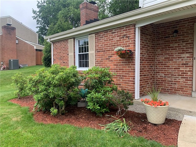 107 Fenwick Dr, Ross Twp, PA 15237 - view of side of home with brick siding, a chimney, and a lawn