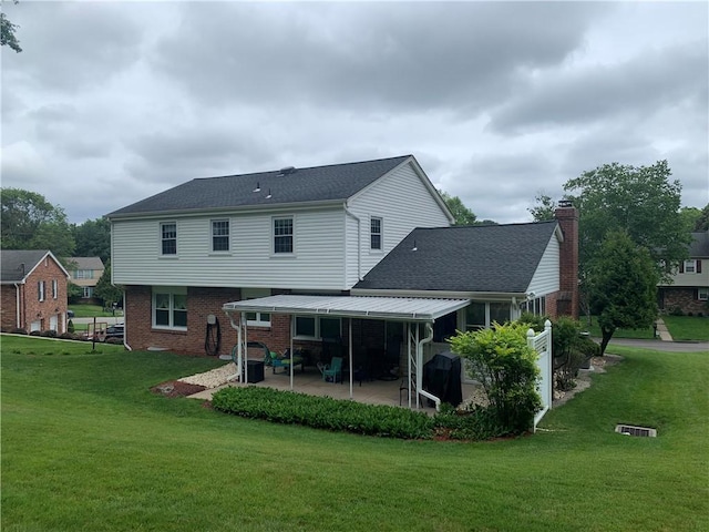 107 Fenwick Dr, Ross Twp, PA 15237 - rear view of property with a patio area, brick siding, and a yard