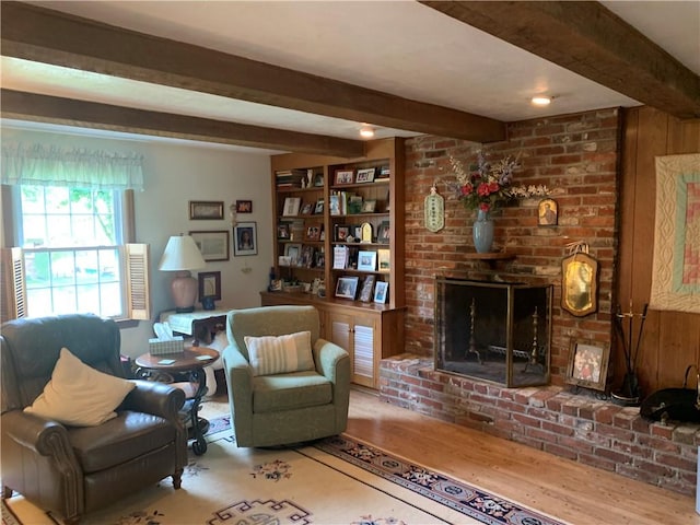107 Fenwick Dr, Ross Twp, PA 15237 - living area with beamed ceiling, wood finished floors, and a brick fireplace