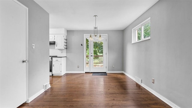 108 Tanglewood Dr, Middlesex Twp, PA 16059 - unfurnished dining area featuring dark wood finished floors and baseboards