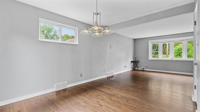 108 Tanglewood Dr, Middlesex Twp, PA 16059 - spare room with healthy amount of natural light, a chandelier, and wood finished floors