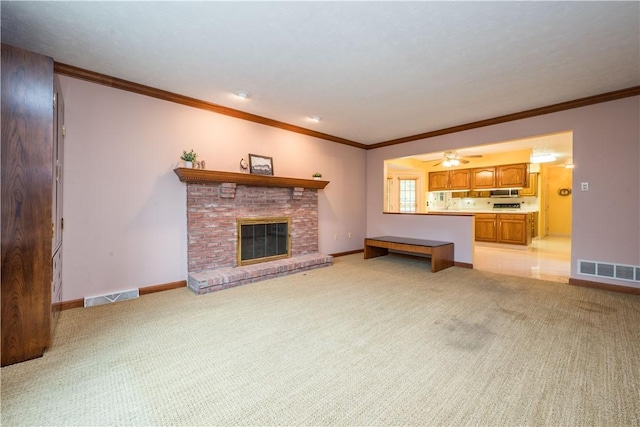 221 William Dr, North Strabane, PA 15317 - unfurnished living room with light colored carpet, ornamental molding, a ceiling fan, and a fireplace