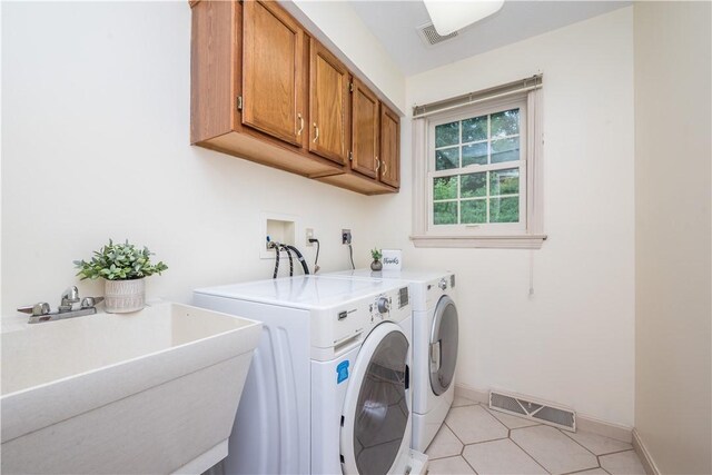 221 William Dr, North Strabane, PA 15317 - washroom featuring cabinet space, washer and clothes dryer, and light tile patterned floors