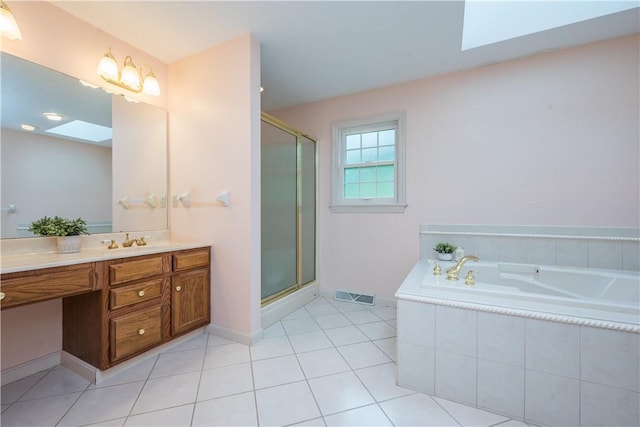 221 William Dr, North Strabane, PA 15317 - full bathroom with a skylight, vanity, a stall shower, and a bath