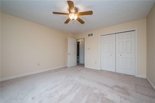 221 William Dr, North Strabane, PA 15317 - unfurnished bedroom with light colored carpet, a closet, and ceiling fan