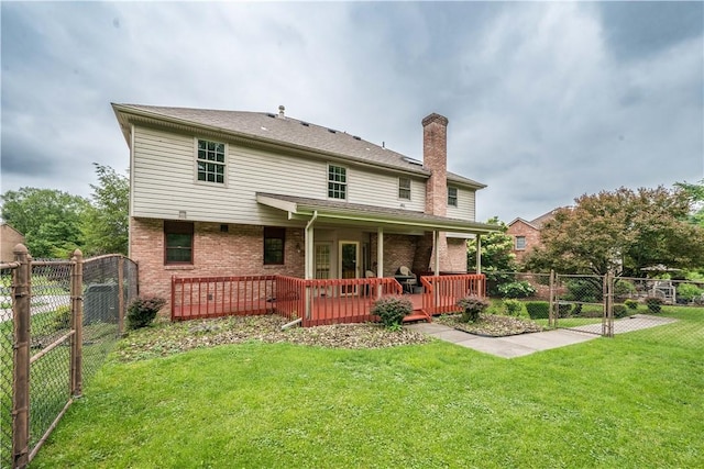 221 William Dr, North Strabane, PA 15317 - rear view of property with brick siding, a chimney, a fenced backyard, and a wooden deck