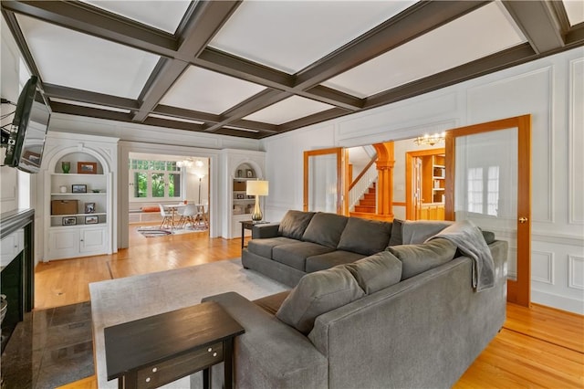 1463 Beechwood Blvd, Squirrel Hill, PA 15217 - living area with a chandelier, a decorative wall, wood finished floors, stairs, and coffered ceiling