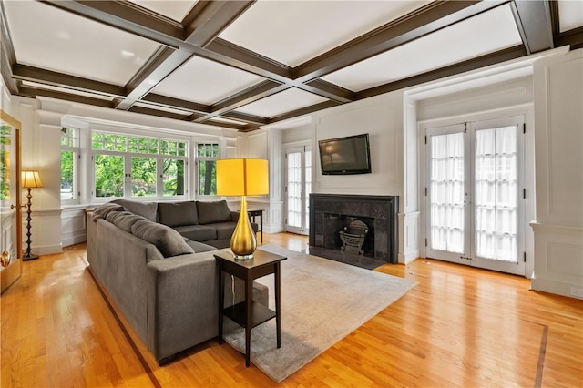 1463 Beechwood Blvd, Squirrel Hill, PA 15217 - living area featuring beam ceiling, coffered ceiling, healthy amount of natural light, a fireplace with flush hearth, and light wood finished floors