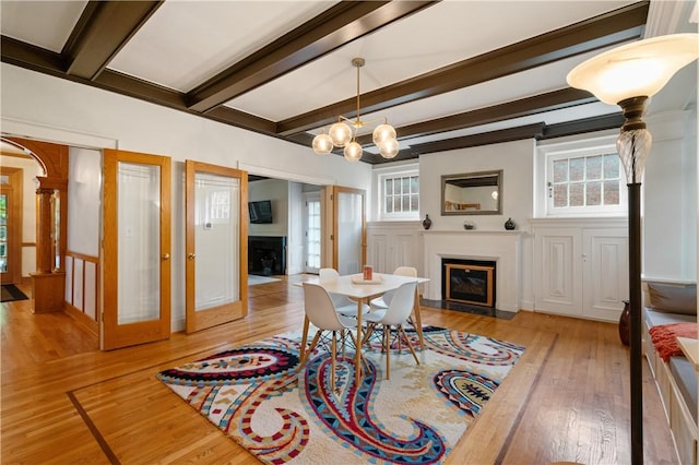 1463 Beechwood Blvd, Squirrel Hill, PA 15217 - dining room featuring a fireplace with flush hearth, light wood-style floors, beamed ceiling, and a chandelier