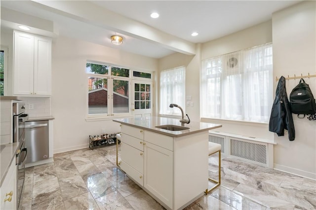 1463 Beechwood Blvd, Squirrel Hill, PA 15217 - kitchen with radiator heating unit, dishwasher, white cabinets, recessed lighting, and a kitchen breakfast bar