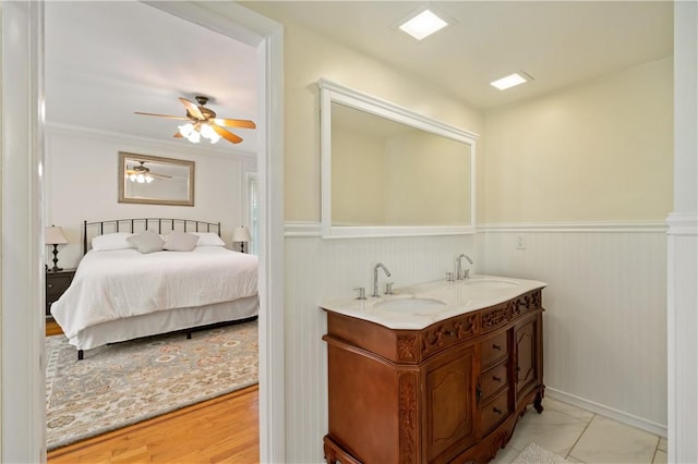 1463 Beechwood Blvd, Squirrel Hill, PA 15217 - ensuite bathroom with double vanity, ceiling fan, and a wainscoted wall