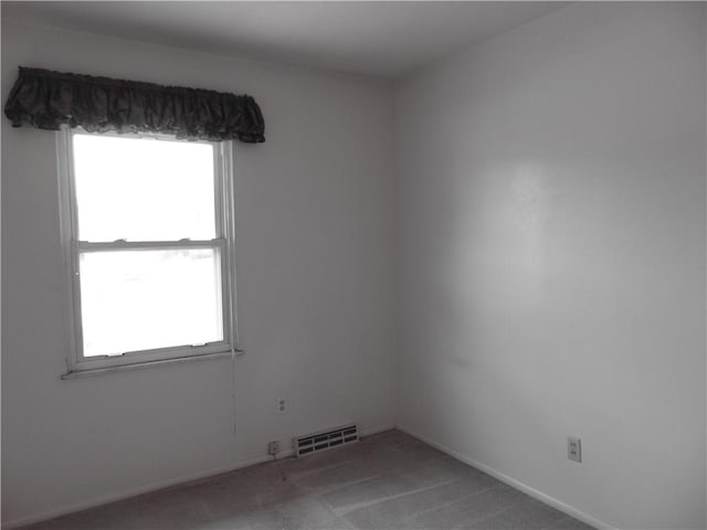 127 Louis Dr, Stowe Twp, PA 15136 - empty room featuring plenty of natural light and light carpet
