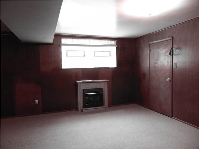 127 Louis Dr, Stowe Twp, PA 15136 - unfurnished living room with wooden walls, carpet, and a glass covered fireplace