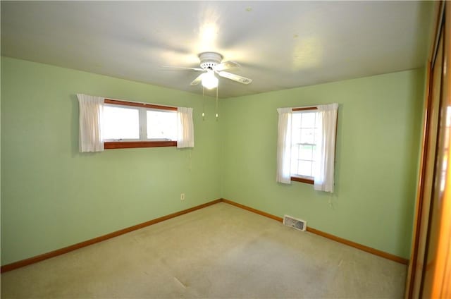 123 Jackson St, Harmony Boro But, PA 16037 - unfurnished room with healthy amount of natural light, ceiling fan, and carpet flooring